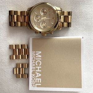 Gold watch 4” to 5” wrist band with extra links.